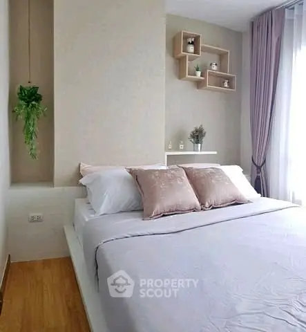 Modern bedroom with stylish decor and natural light