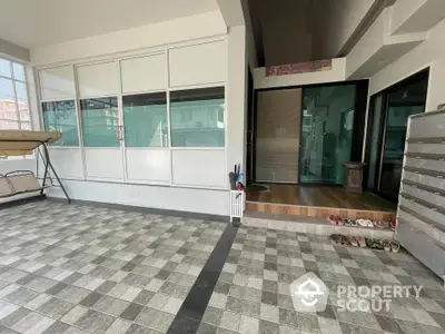 Spacious entrance area with tiled flooring and modern design