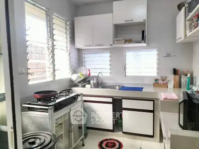 Cozy kitchen with modern appliances and ample natural light