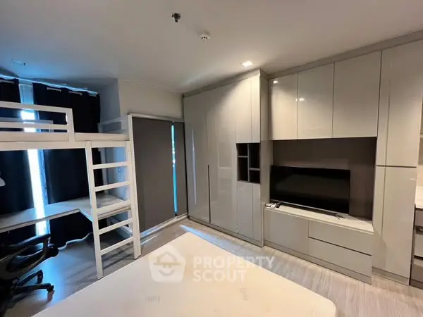 Modern bedroom with loft bed and sleek storage solutions