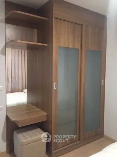 Modern bedroom with wooden wardrobe and vanity set