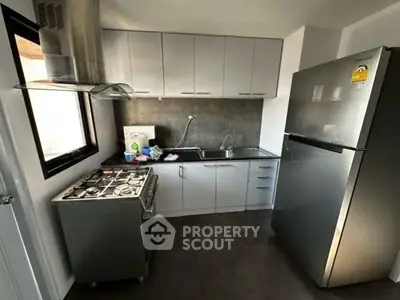 Modern kitchen with stainless steel appliances and sleek cabinetry