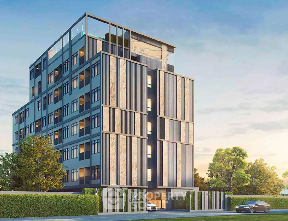 Modern multi-story building with sleek design and lush surroundings.