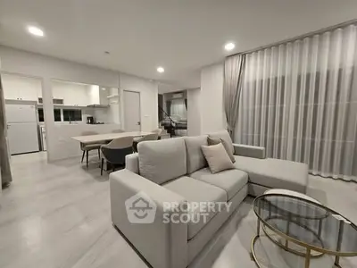 Modern open-plan living room with elegant furniture and stylish decor