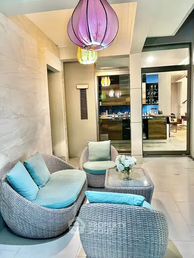 Stylish modern living area with chic furniture and vibrant lighting