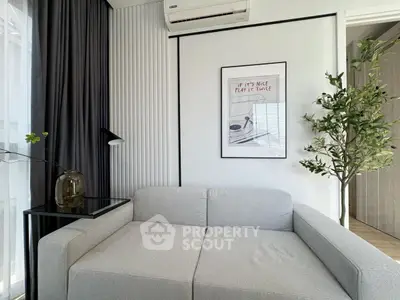 Modern living room with stylish gray sofa and elegant decor