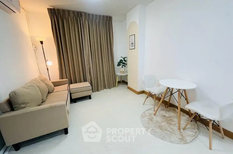 Cozy living room with modern furniture and warm lighting, perfect for relaxation and entertaining guests.