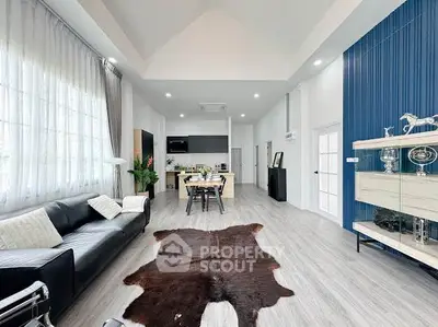 Spacious modern living room with high ceilings and stylish decor