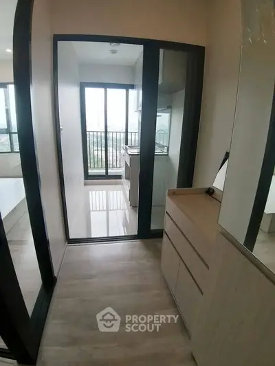 Modern apartment with sleek kitchen and balcony view