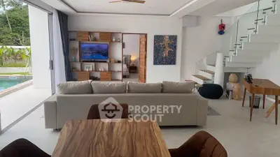 Spacious modern living room with pool view and elegant decor