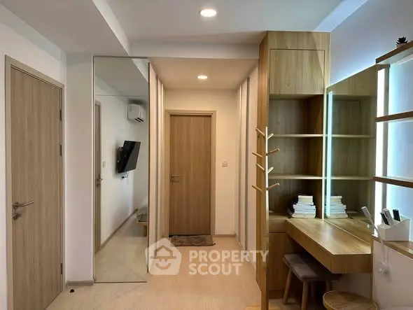 Modern study area with wooden desk and shelves in a stylish apartment