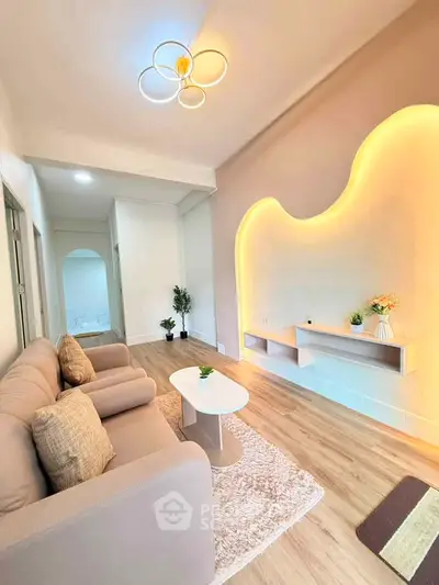 Modern living room with stylish lighting and cozy seating area