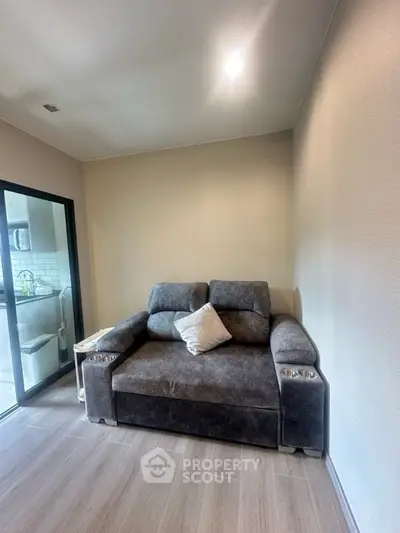 Cozy living room with plush gray sofa and modern decor