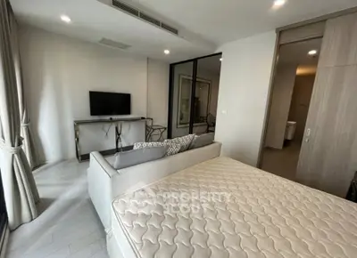 Modern bedroom with stylish decor and comfortable bed in a contemporary apartment.