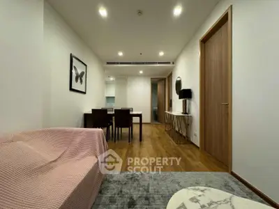 Modern living room with wooden flooring and stylish furniture