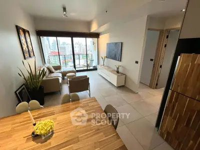 Modern living room with city view, open layout, and stylish decor