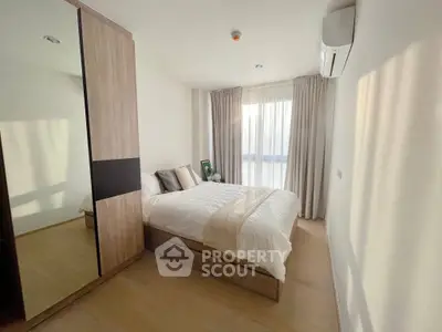 Bright and cozy bedroom with modern furnishings and natural light