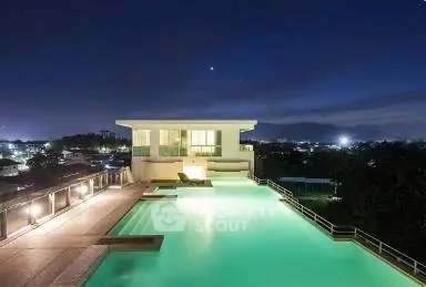 Luxurious rooftop infinity pool with stunning night city view