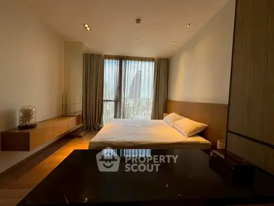 Modern bedroom with large window and minimalist design, featuring wooden accents and a serene ambiance.
