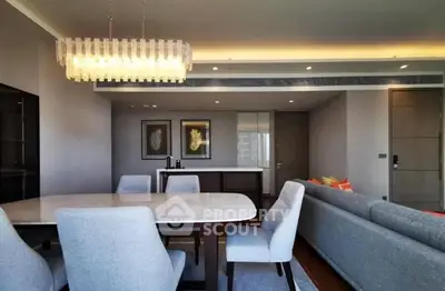 Elegant modern living room with stylish chandelier and cozy seating area