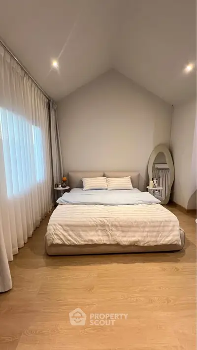 Elegant bedroom with modern decor and cozy ambiance