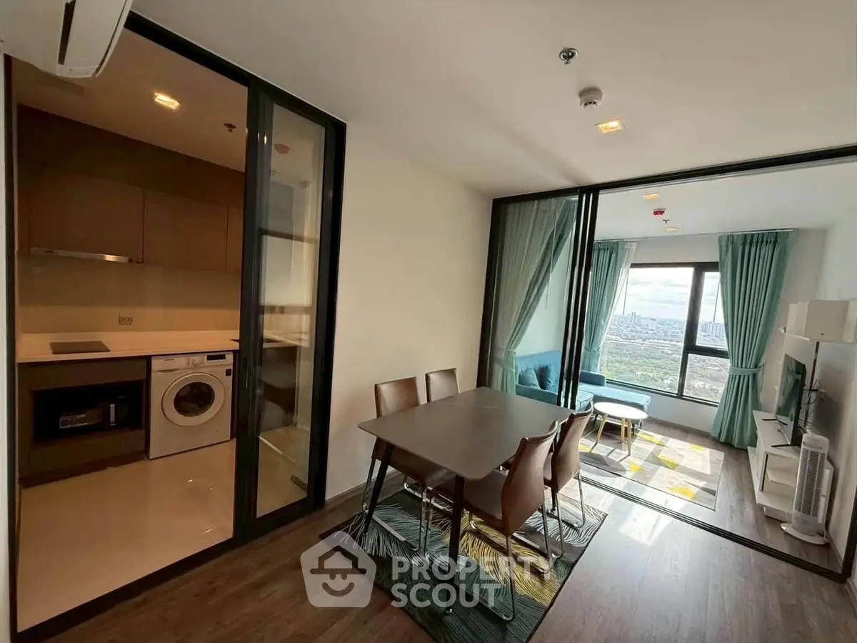 Modern apartment with open kitchen and stunning city view from living room