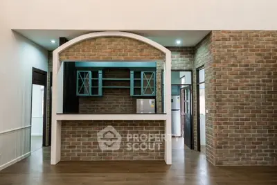 Charming kitchen with brick wall accents and open layout design