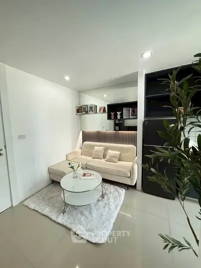 Modern living room with cozy sofa and stylish decor