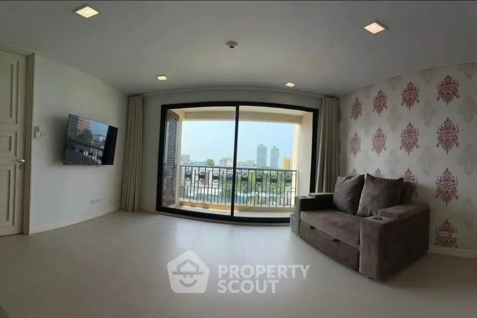Spacious living room with balcony view in modern apartment
