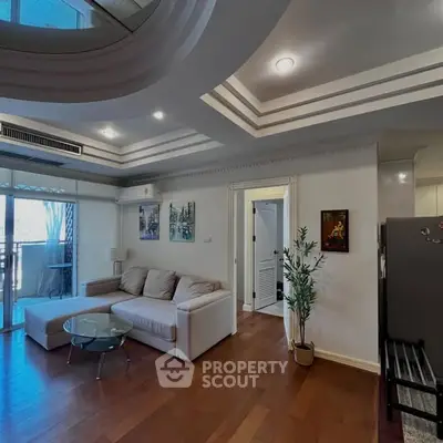 Spacious living room with modern design and balcony access