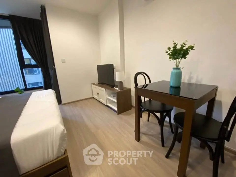 Modern studio apartment with cozy living area and stylish decor