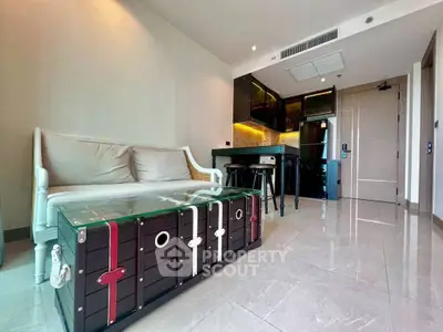 Modern living room with stylish furniture and sleek kitchen in open layout