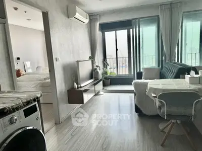 Modern apartment living room with balcony and bedroom view