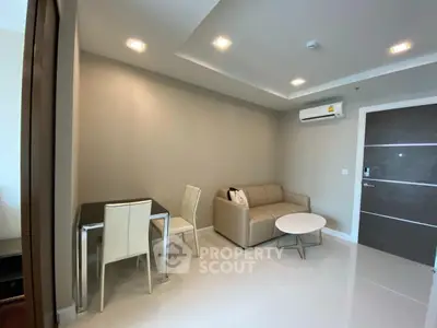 Modern living room with sleek furniture and air conditioning in a stylish apartment.