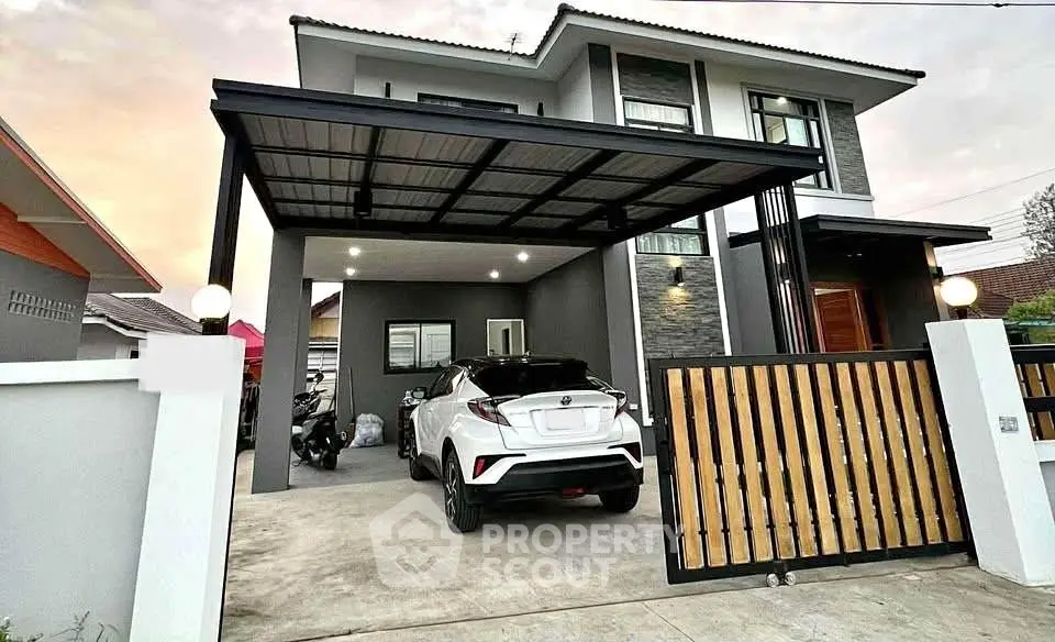 Modern two-story house with carport and sleek exterior design.