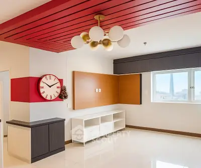 Modern living room with unique ceiling design and large window offering natural light.