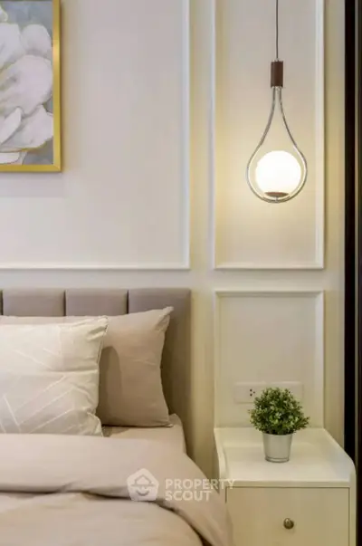 Elegant bedroom with modern lighting and stylish decor