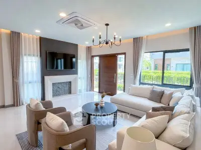 Luxurious living room with modern decor and large windows for natural light.