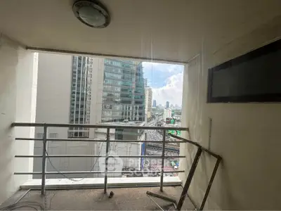 Urban balcony with city view, ideal for relaxation and enjoying the skyline.