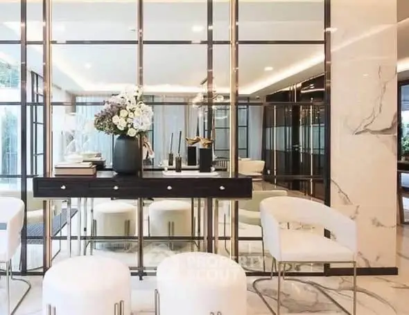 Luxurious modern living room with elegant decor and mirrored walls