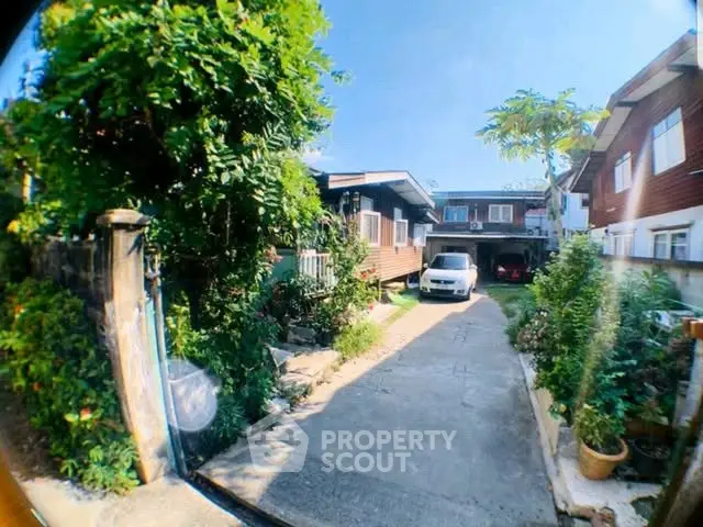 Charming suburban home with lush garden and driveway, perfect for family living.