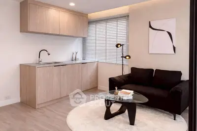 Modern living room with sleek kitchenette and stylish decor