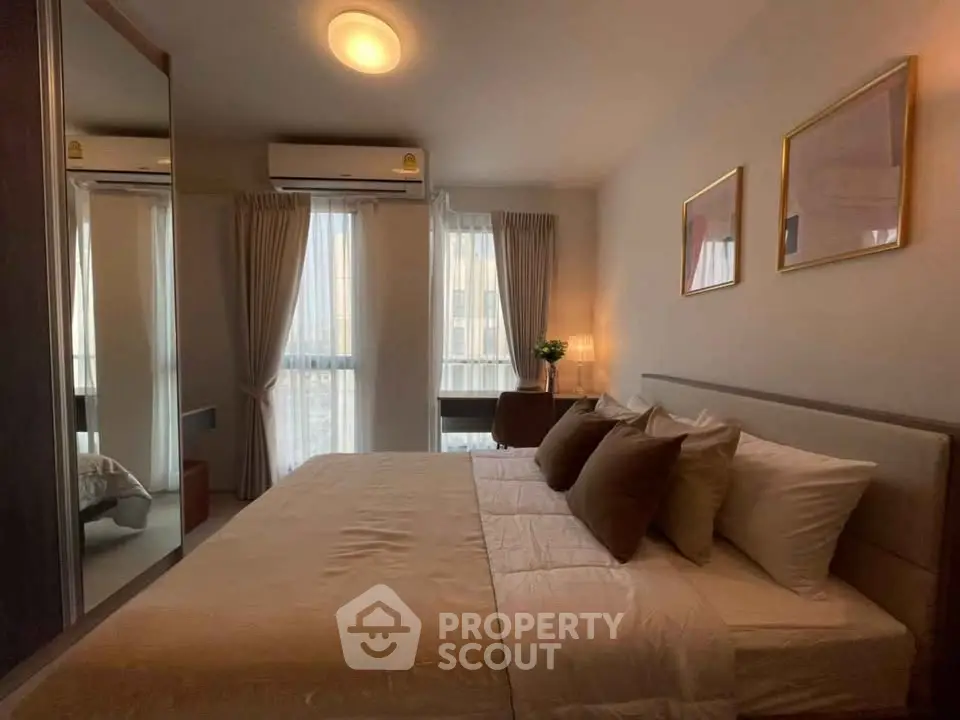 Cozy bedroom with elegant decor and natural light, featuring a comfortable bed and stylish furnishings.