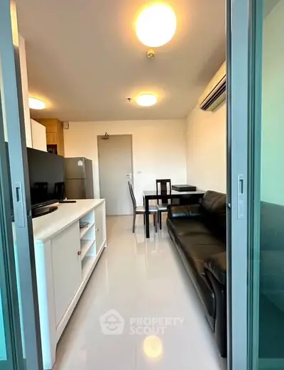 Modern apartment interior with sleek kitchen and cozy living area