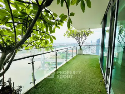 Stunning balcony with lush greenery and panoramic city view, perfect for relaxation and entertainment.