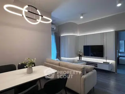 Modern living room with stylish lighting and sleek furniture, perfect for contemporary living.