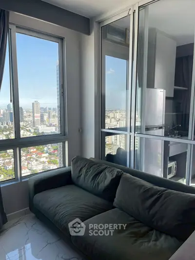 Modern apartment with stunning city view and cozy living area.