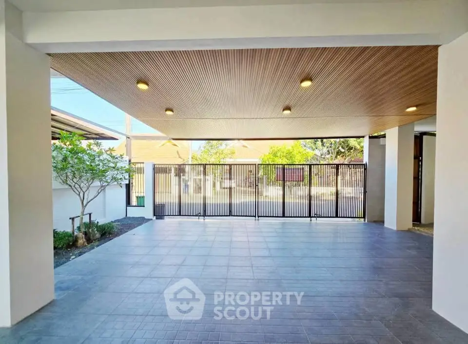 Spacious modern carport with sleek design and ample natural light, perfect for multiple vehicles.