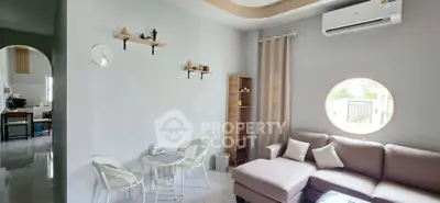 Modern living room with cozy sofa and stylish decor