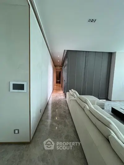 Luxurious modern living room with sleek marble flooring and elegant sofa